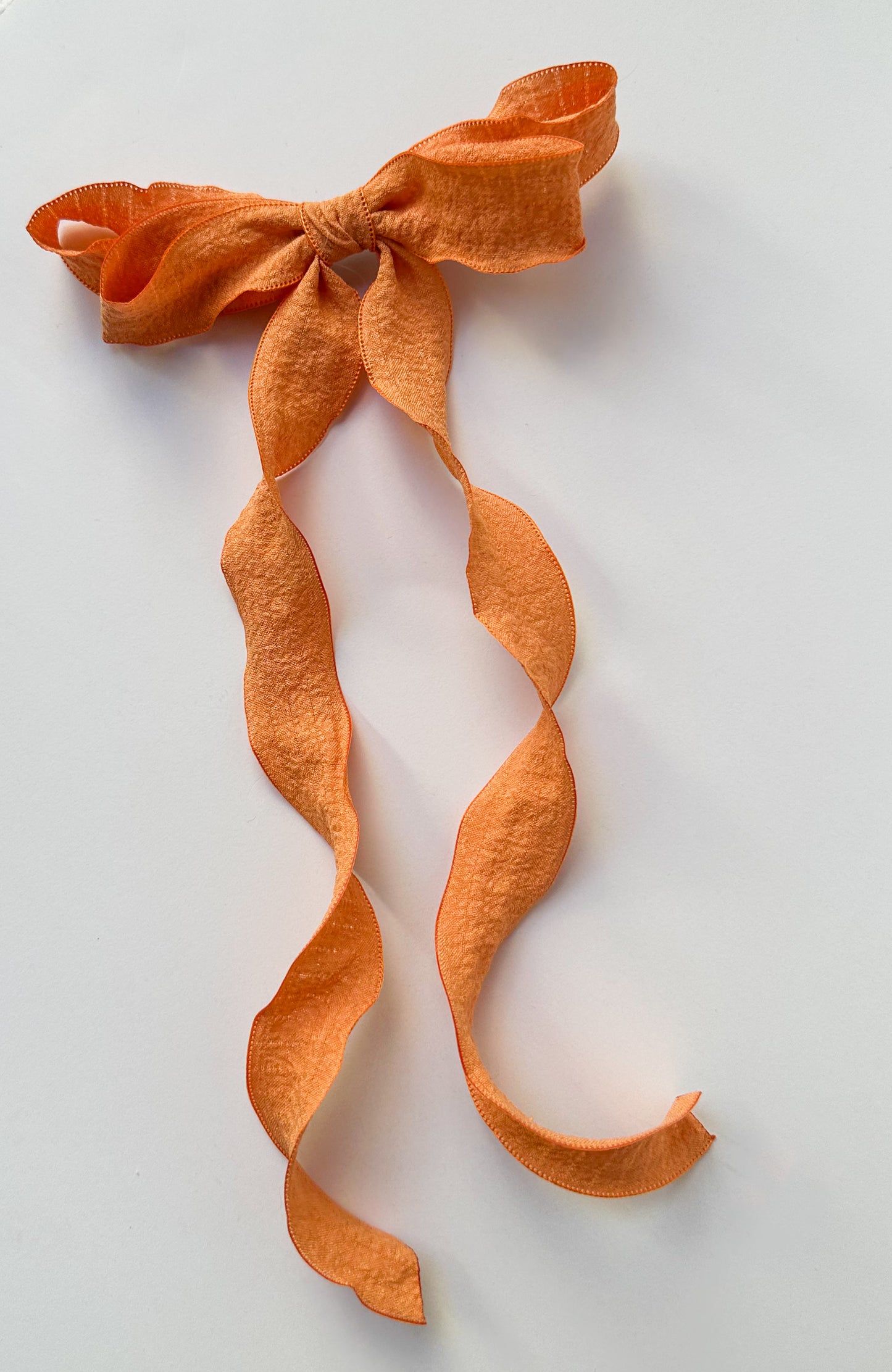 Small orange wavy wrinkle laced edge Hair Bow